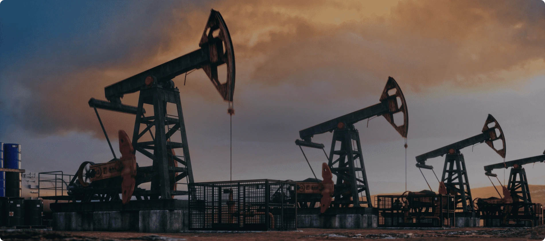 Multiple oil rigs pumping oil against a dramatic sunset sky Multiple oil rigs pumping oil against a dramatic sunset sky